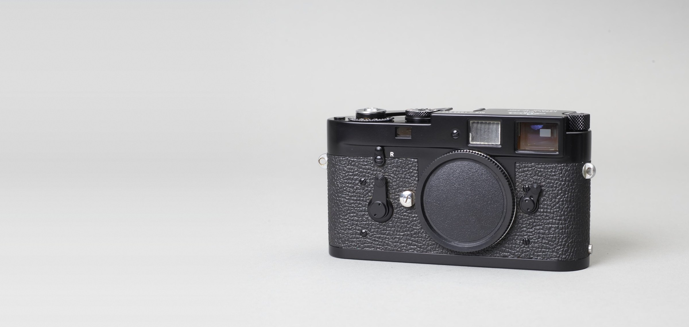 Black Leica M2 on a grey studio background